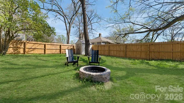 a view of a backyard with tree s