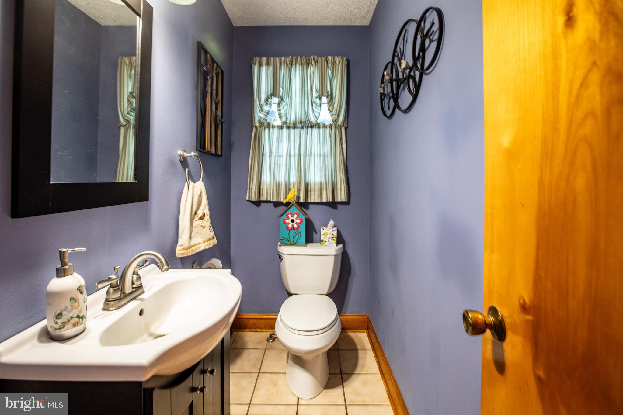 12 Millstream Road Cream Ridge, NJ 08514 - Photo 15 of 76 a bathroom with a toilet sink and mirror