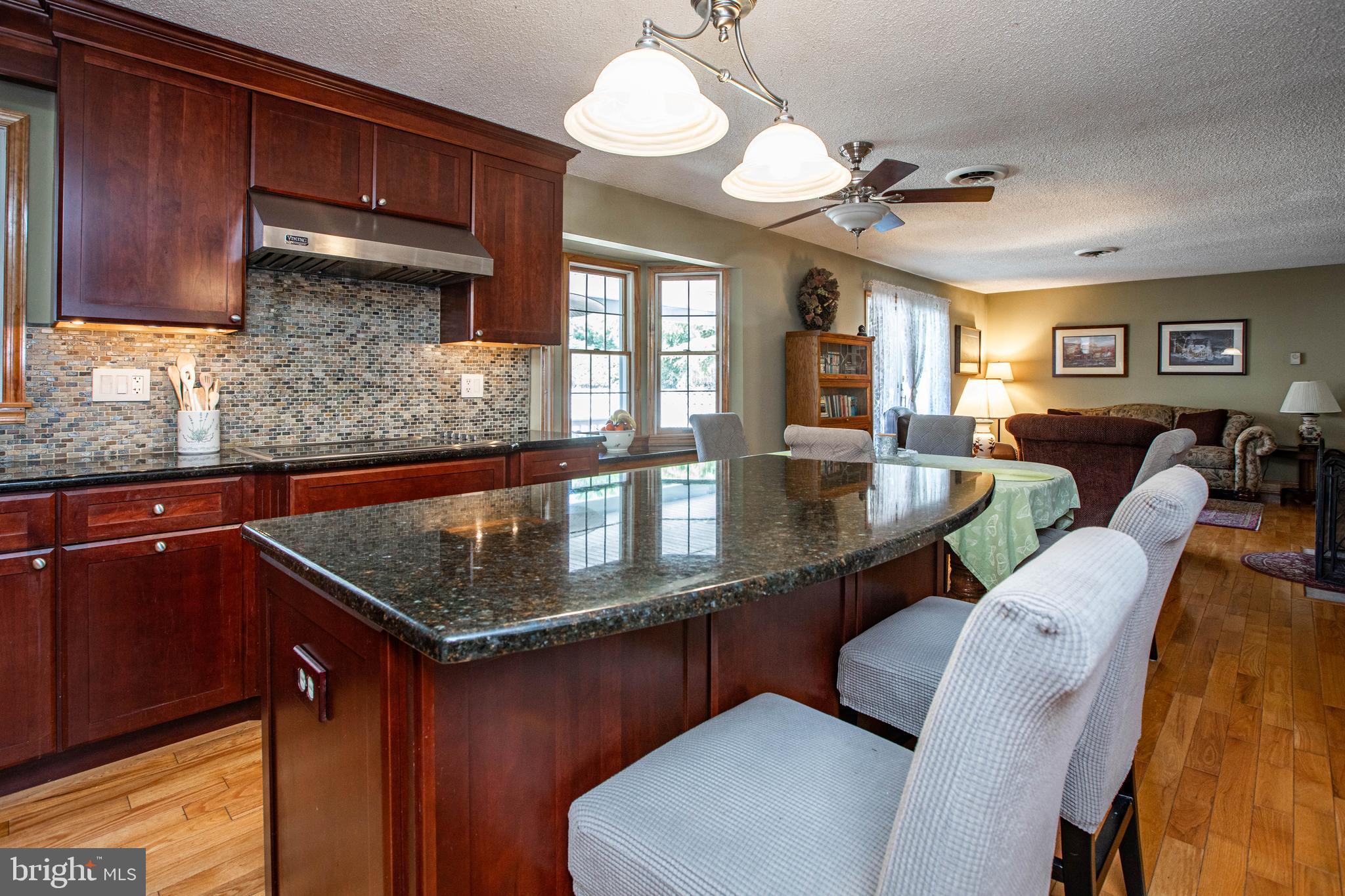 12 Millstream Road Cream Ridge, NJ 08514 - Photo 16 of 76 a kitchen with stainless steel appliances granite countertop a sink dishwasher and cabinets with wooden floor