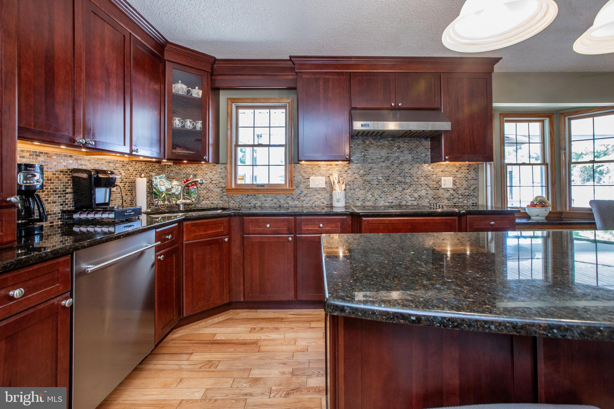 12 Millstream Road Cream Ridge, NJ 08514 - Photo 17 of 76 a kitchen with stainless steel appliances granite countertop a stove a sink and a microwave
