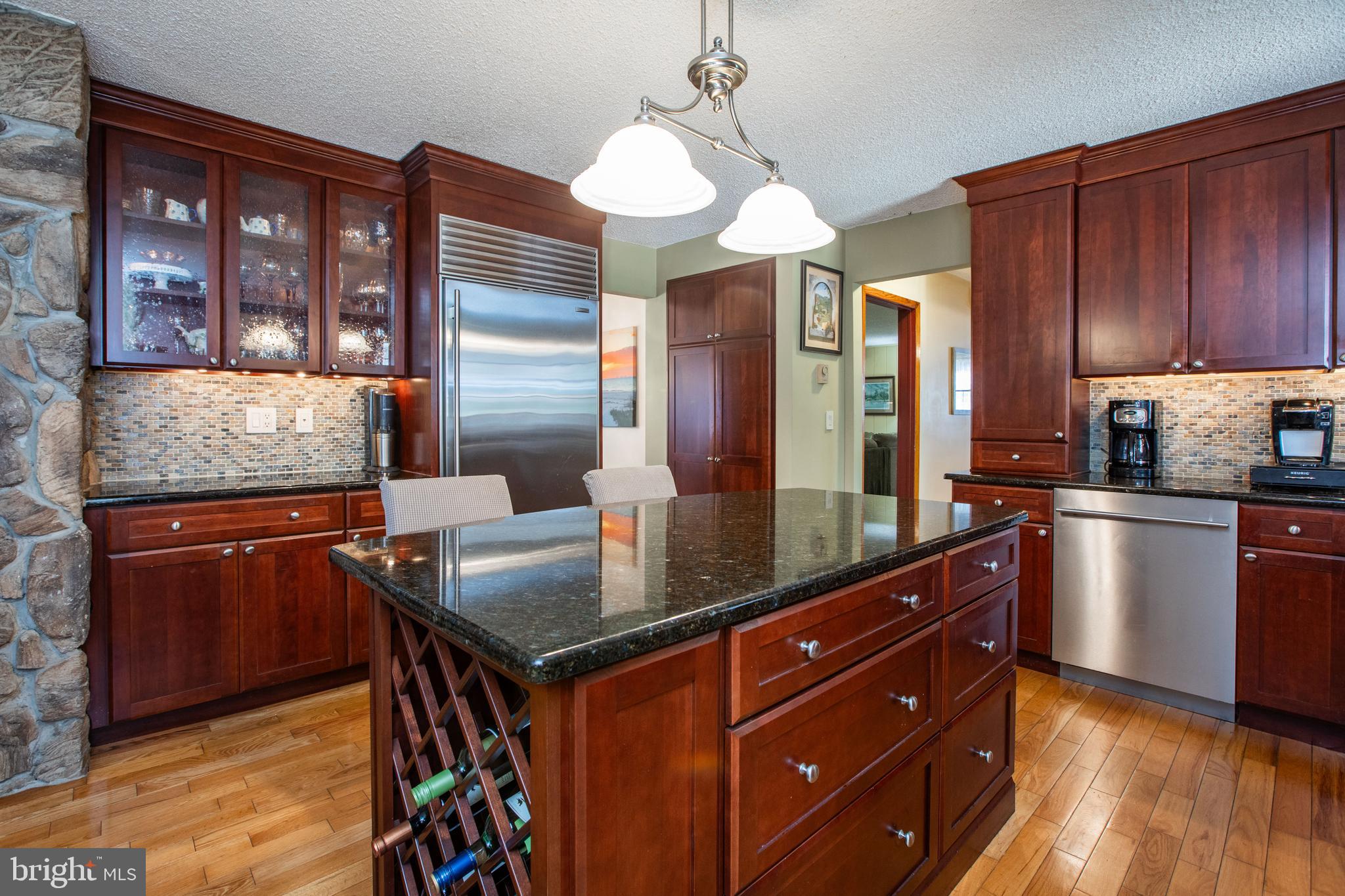 12 Millstream Road Cream Ridge, NJ 08514 - Photo 19 of 76 a kitchen with stainless steel appliances granite countertop wooden cabinets a refrigerator and dishwasher