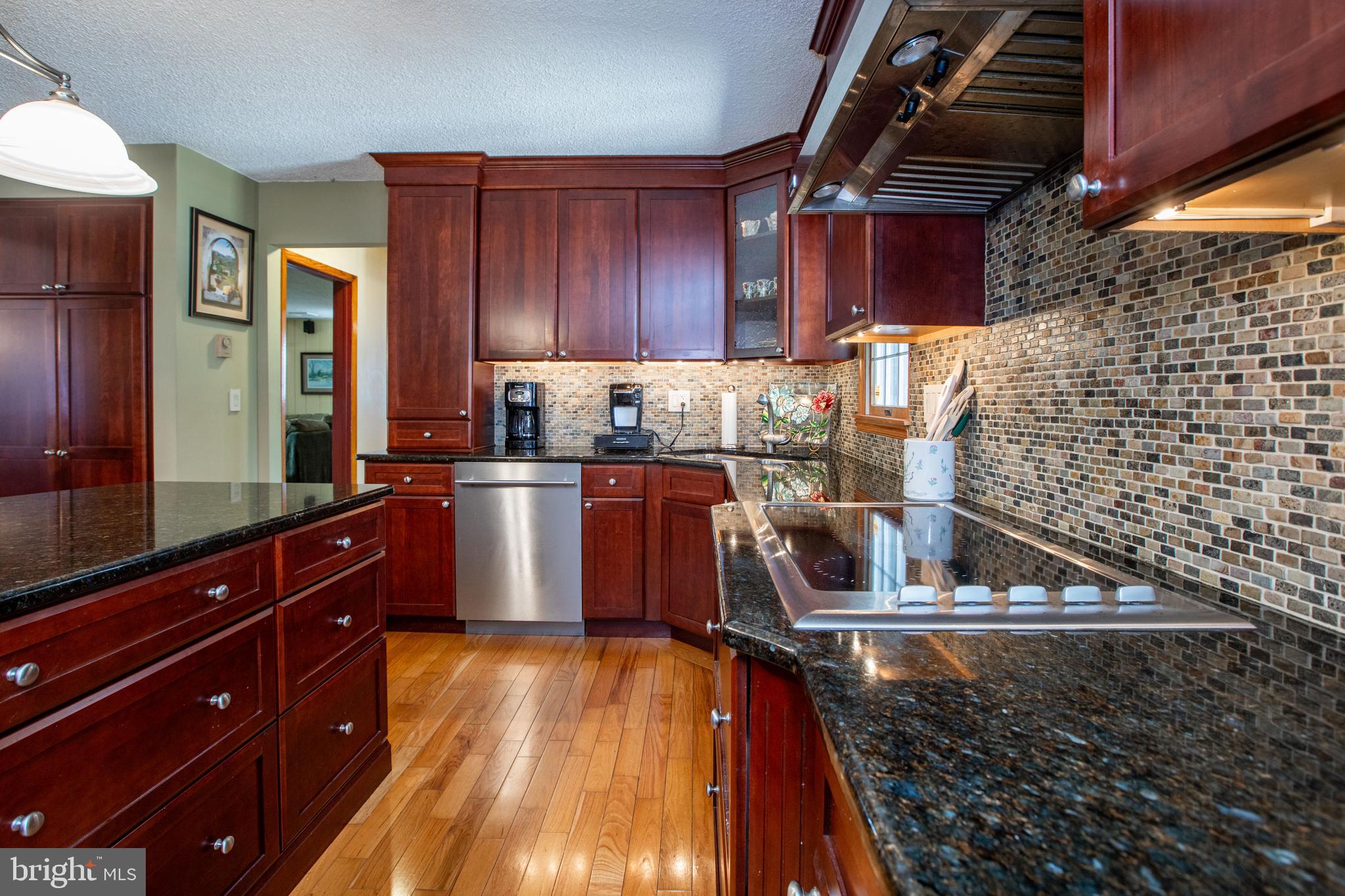 12 Millstream Road Cream Ridge, NJ 08514 - Photo 20 of 76 a kitchen with wooden cabinets and a sink