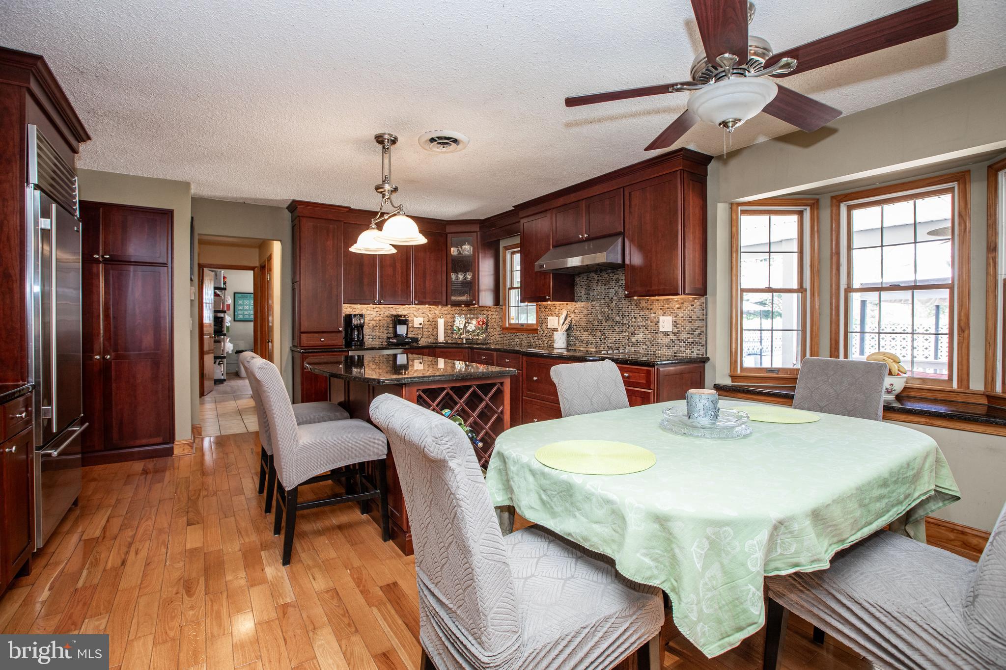 12 Millstream Road Cream Ridge, NJ 08514 - Photo 25 of 76 a view of a dining room with furniture window and wooden floor