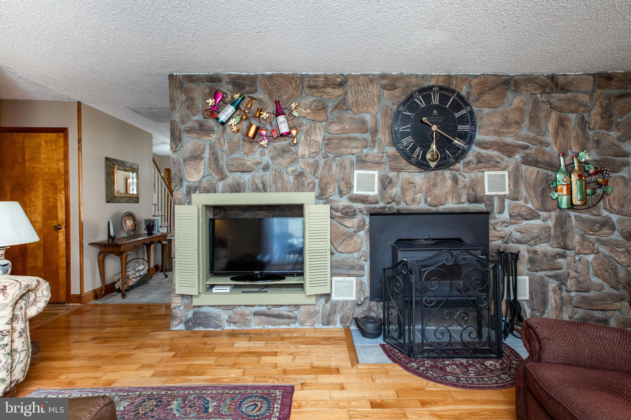 12 Millstream Road Cream Ridge, NJ 08514 - Photo 30 of 76 a living room with furniture and a fireplace