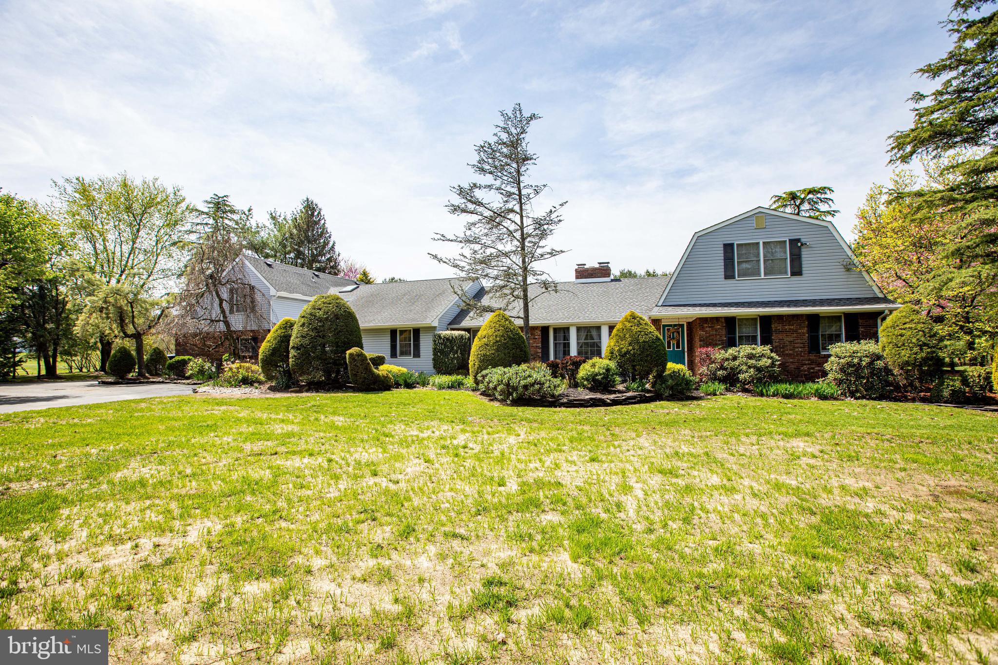 12 Millstream Road Cream Ridge, NJ 08514 - Photo 3 of 76 a front view of a house with garden