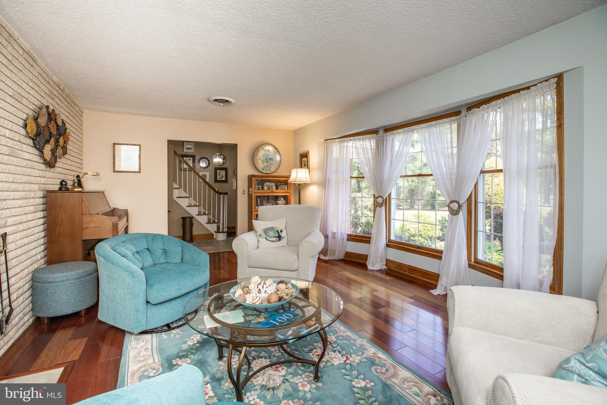 12 Millstream Road Cream Ridge, NJ 08514 - Photo 33 of 76 a living room with furniture and a large window