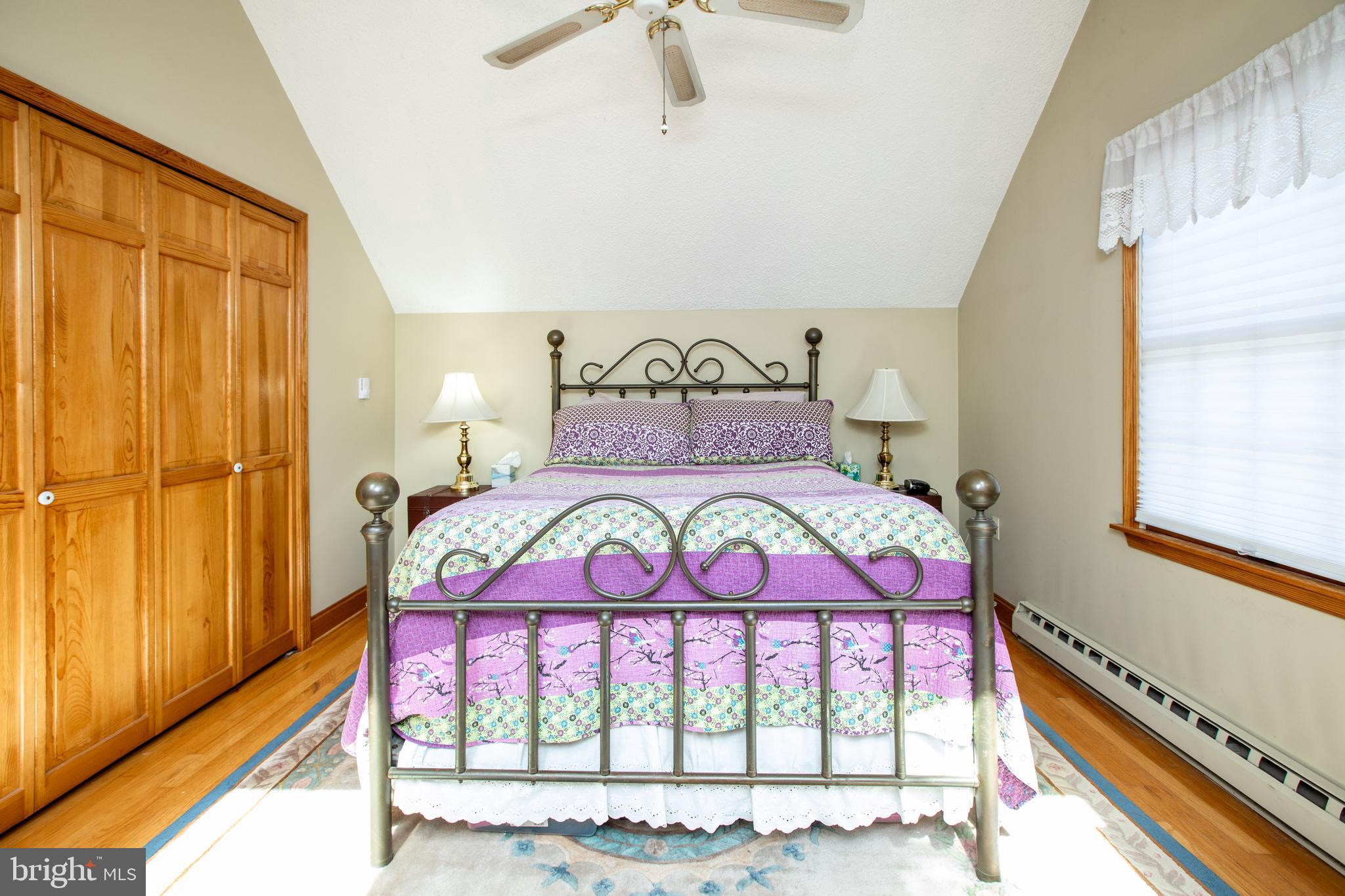 12 Millstream Road Cream Ridge, NJ 08514 - Photo 43 of 76 a bed room with a bed and a painting on the wall