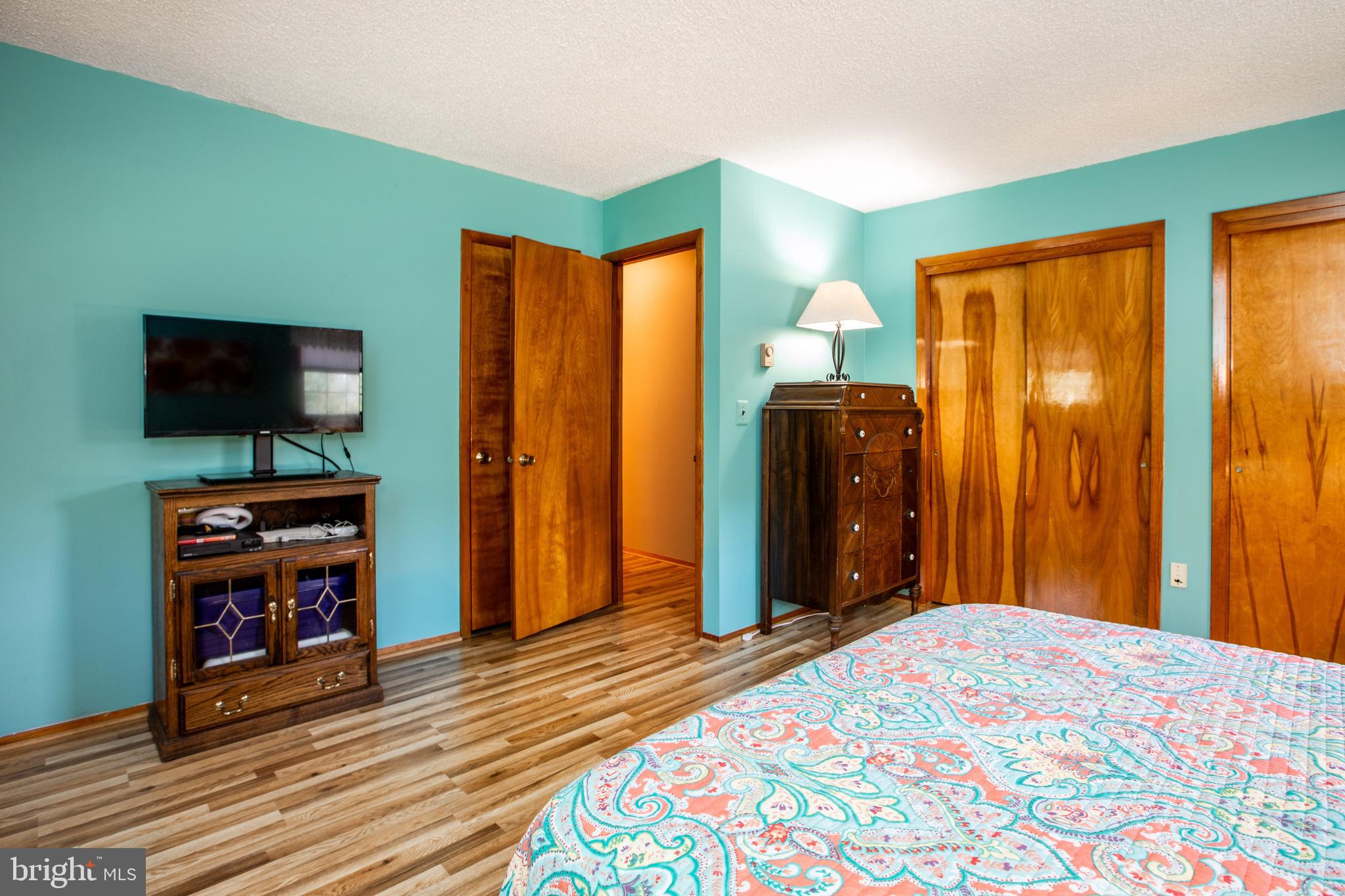 12 Millstream Road Cream Ridge, NJ 08514 - Photo 51 of 76 a bedroom with a bed and a television