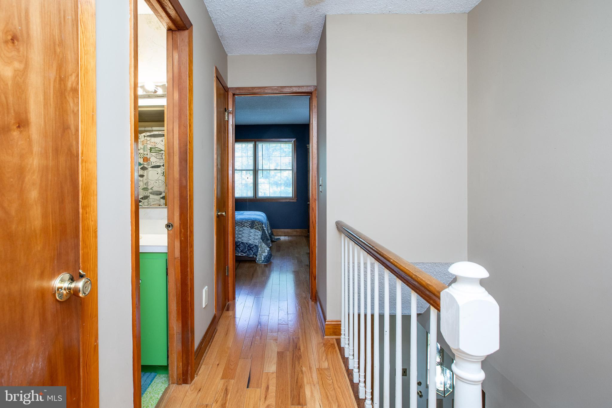 12 Millstream Road Cream Ridge, NJ 08514 - Photo 57 of 76 a view of a hallway with wooden floor and entryway
