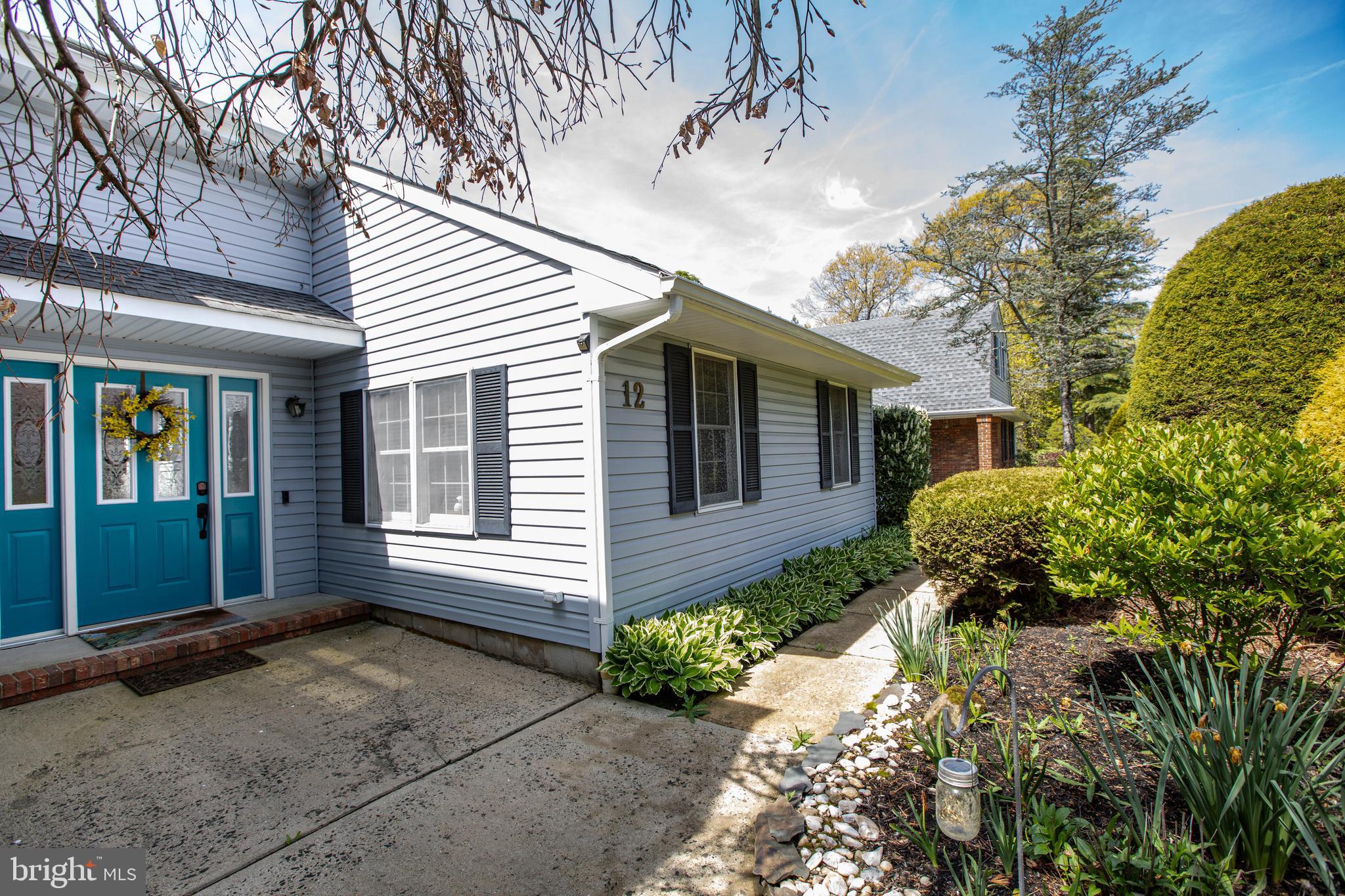 12 Millstream Road Cream Ridge, NJ 08514 - Photo 6 of 76 a front view of a house with garden
