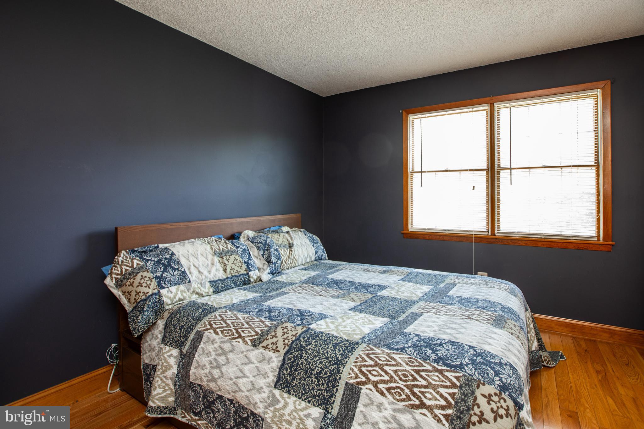 12 Millstream Road Cream Ridge, NJ 08514 - Photo 61 of 76 a bed sitting in a bedroom next to a window