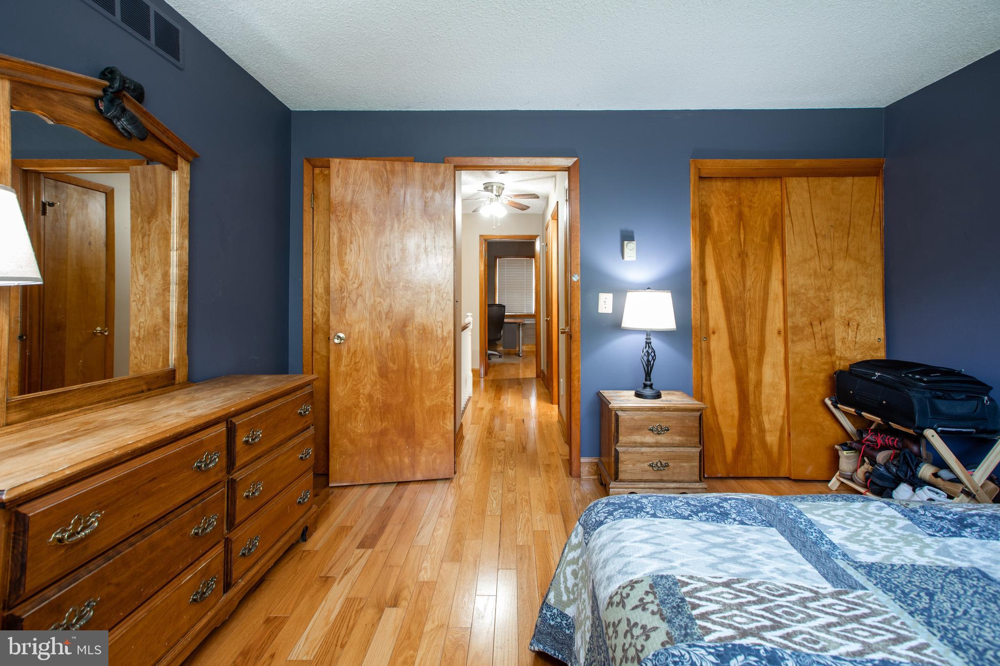 12 Millstream Road Cream Ridge, NJ 08514 - Photo 62 of 76 a bedroom with a bed and wooden floor