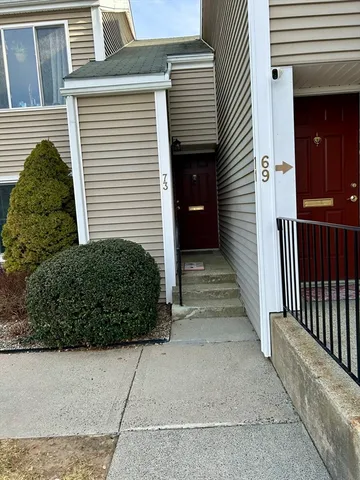 a view of a pathway front of house