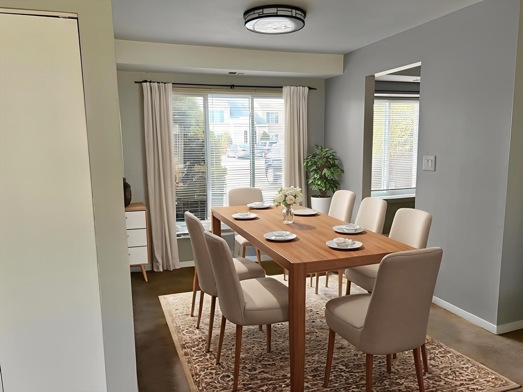 71 Nassau Drive, Unit 71 Springfield, MA 01129 - Photo 3 of 19 a view of a dining room with furniture and window