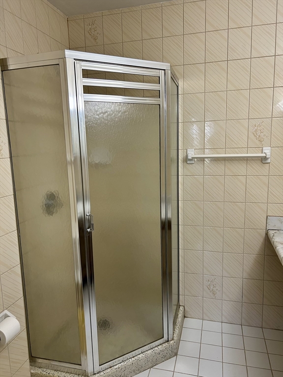 71 Nassau Drive, Unit 71 Springfield, MA 01129 - Photo 9 of 19 a bathroom with a glass shower door