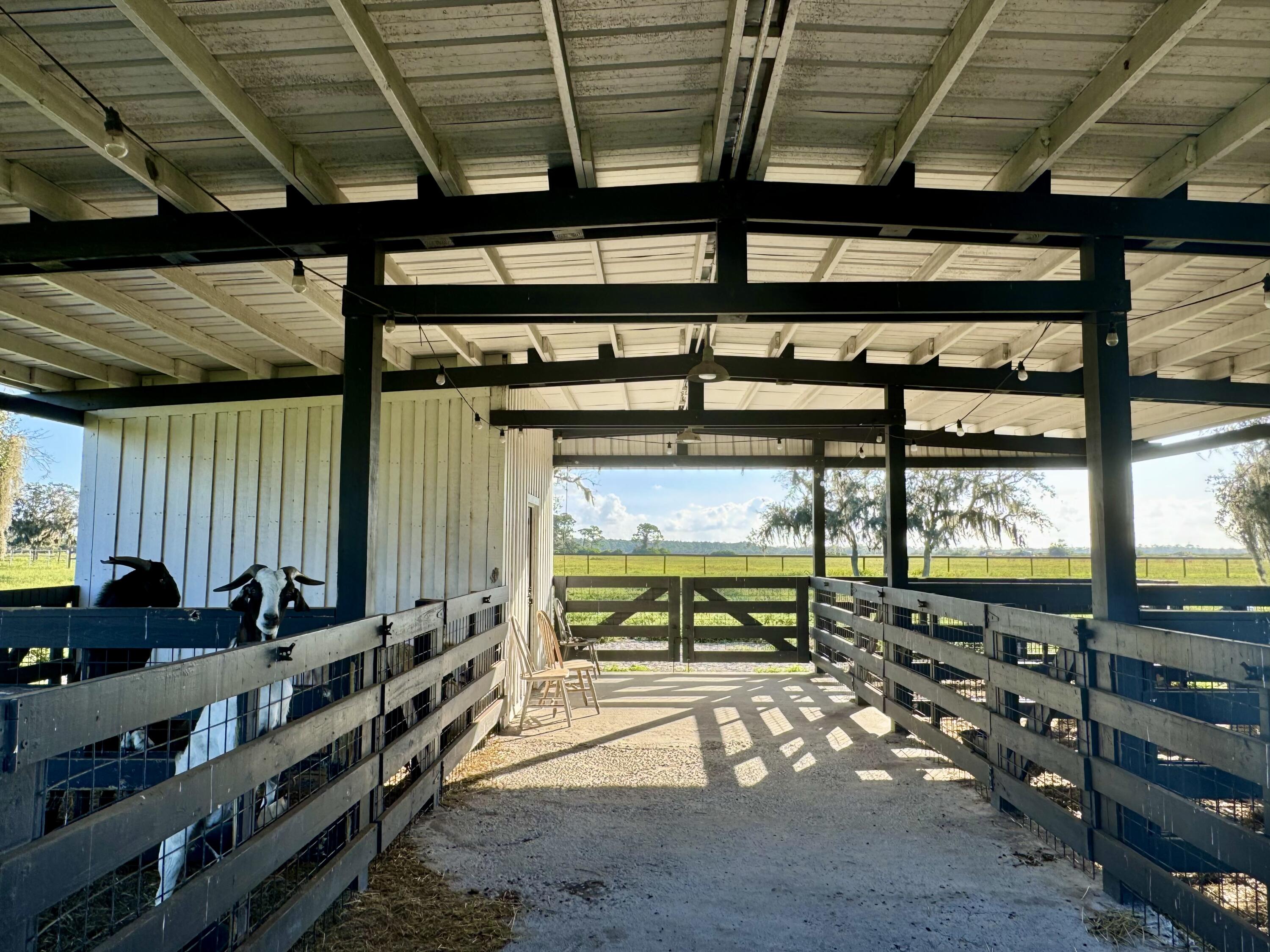 14151 Center Street Okeechobee, FL 34974 - Photo 13 of 16 a room with lots of wooden furniture and windows