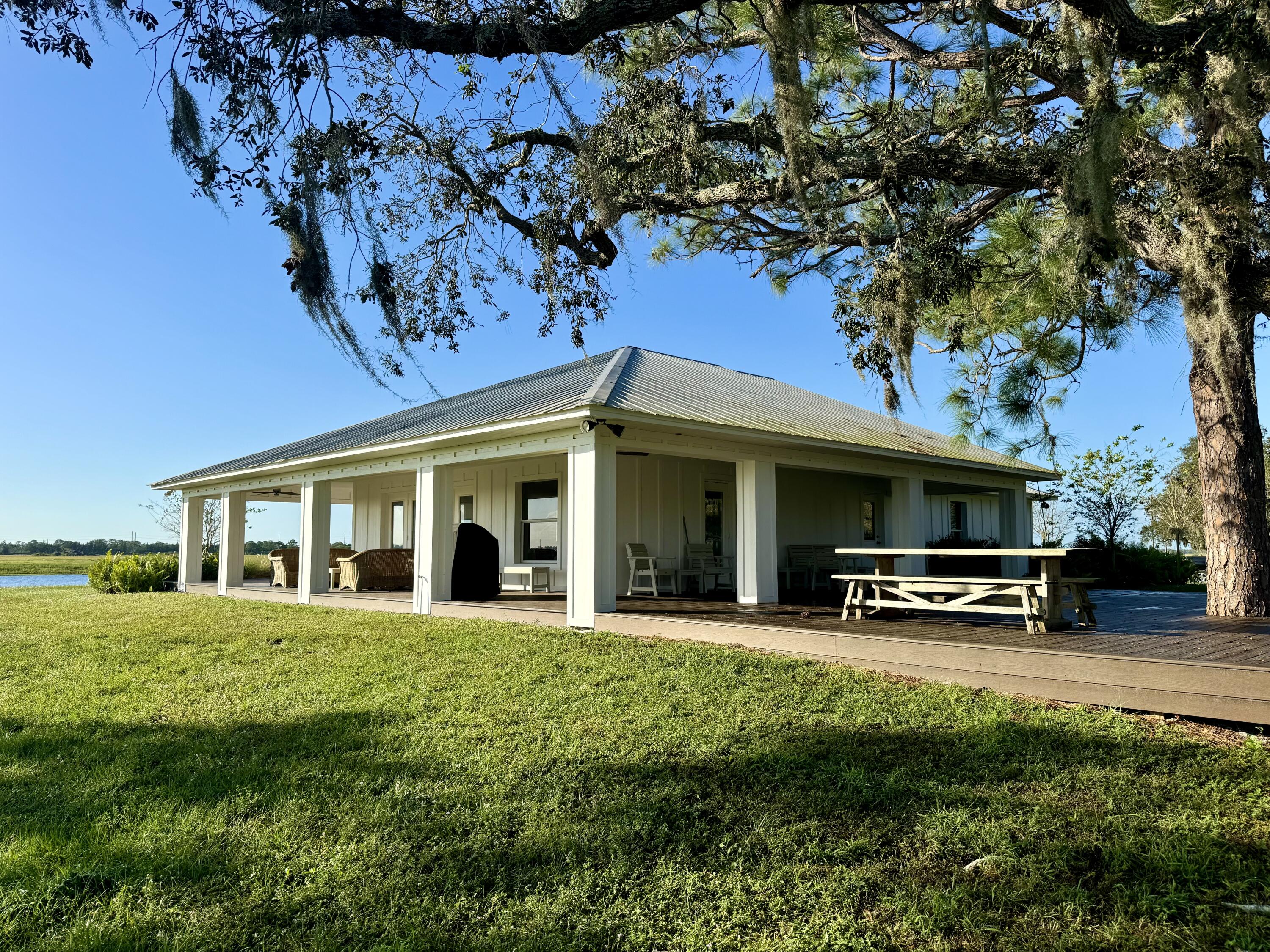 14151 Center Street Okeechobee, FL 34974 - Photo 14 of 16 a view of a house with a patio