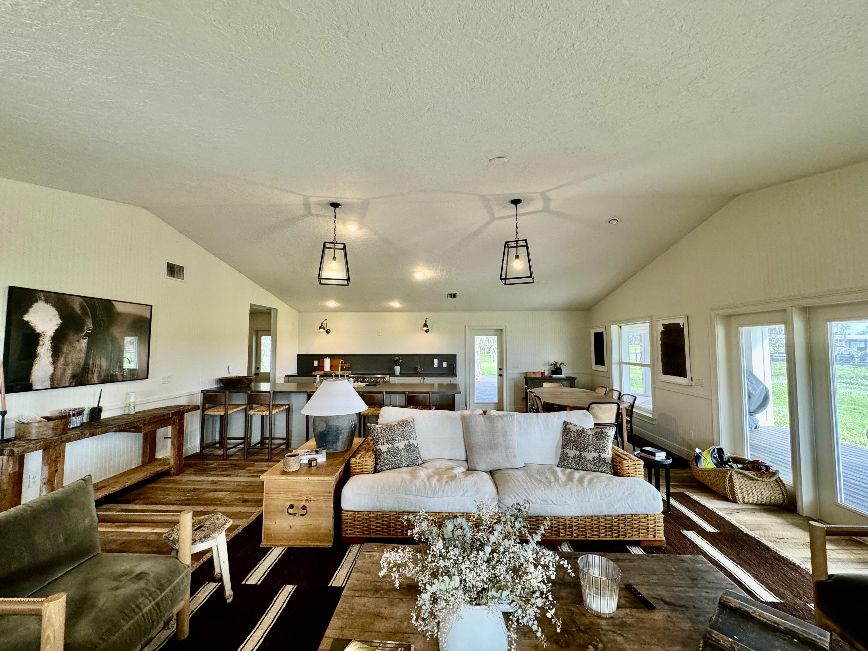 14151 Center Street Okeechobee, FL 34974 - Photo 6 of 16 a living room with lots of furniture and kitchen view