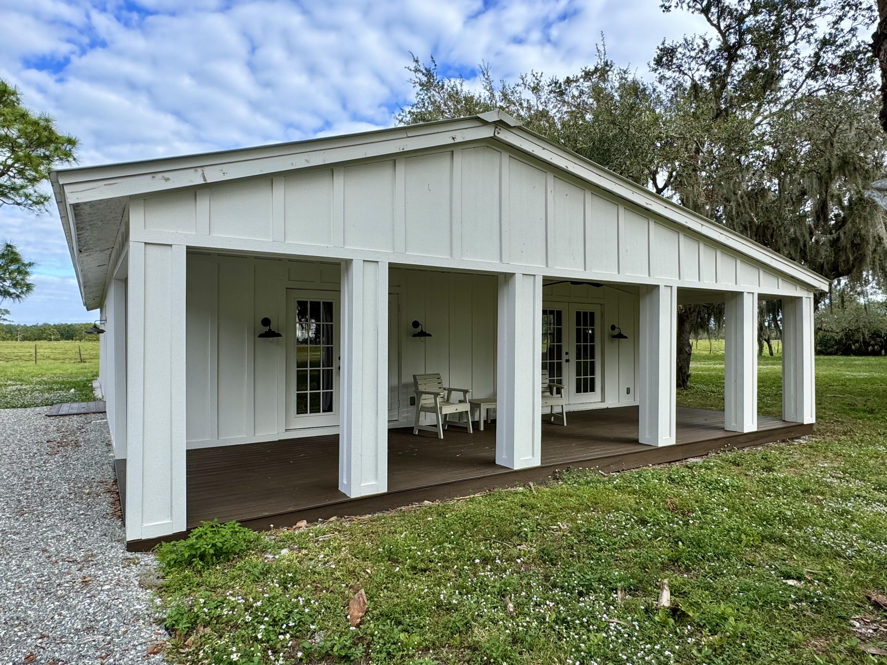 14151 Center Street Okeechobee, FL 34974 - Photo 10 of 16 a front view of a house with a yard