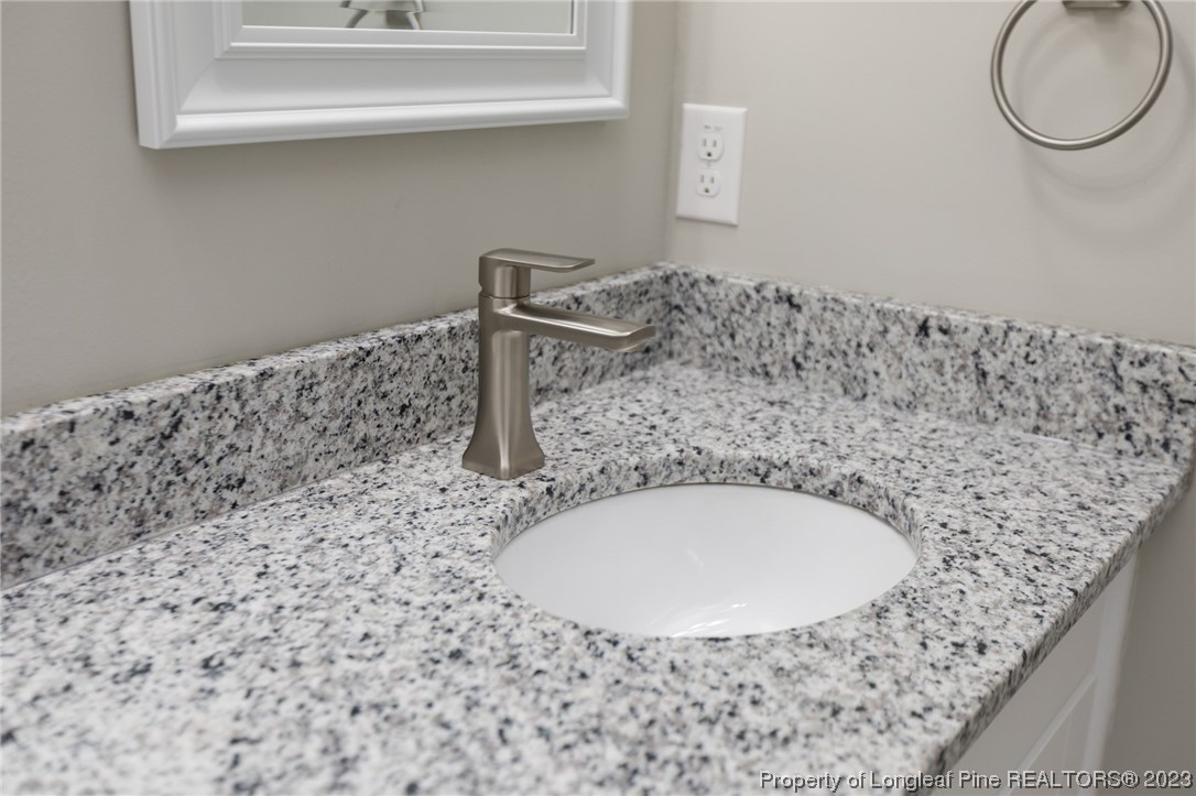 5348 Goldsboro Road Wade, NC 28395 - Photo 11 of 25 a bathroom with a sink and a mirror