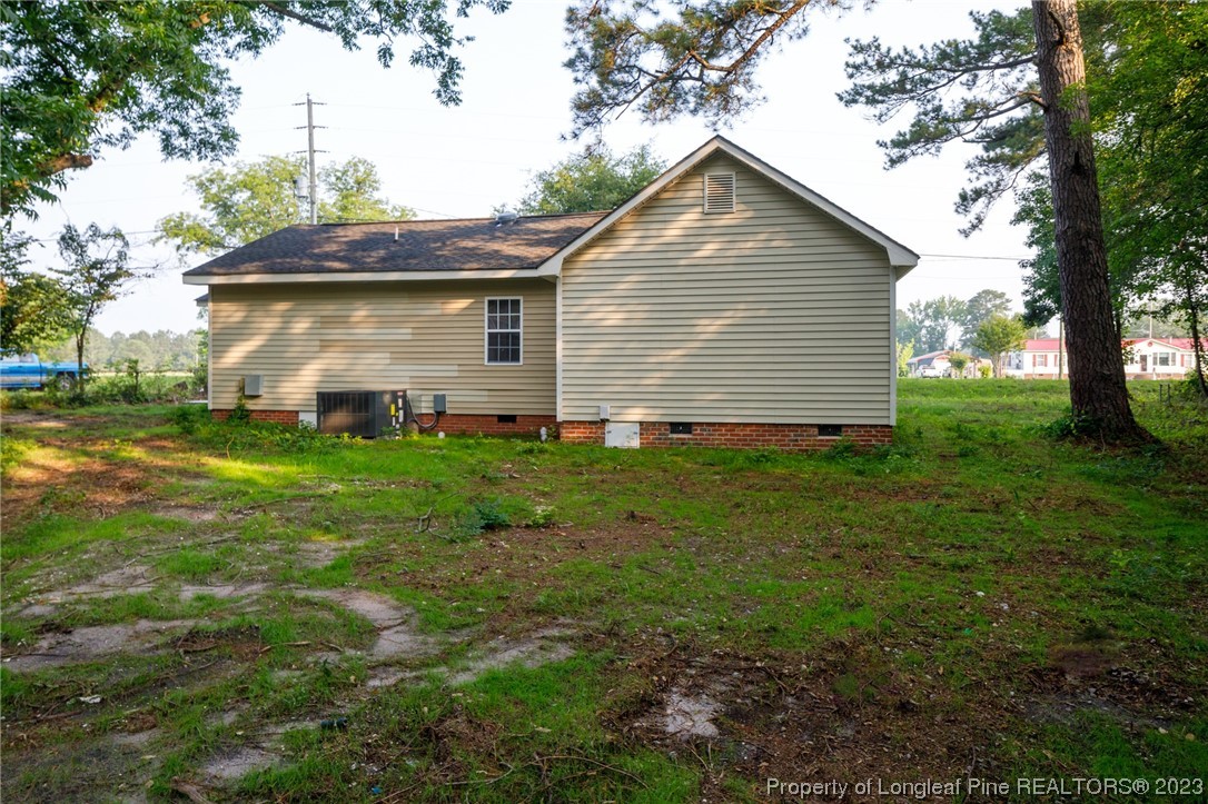 5348 Goldsboro Road Wade, NC 28395 - Photo 25 of 25 a view of a house with yard and a garden