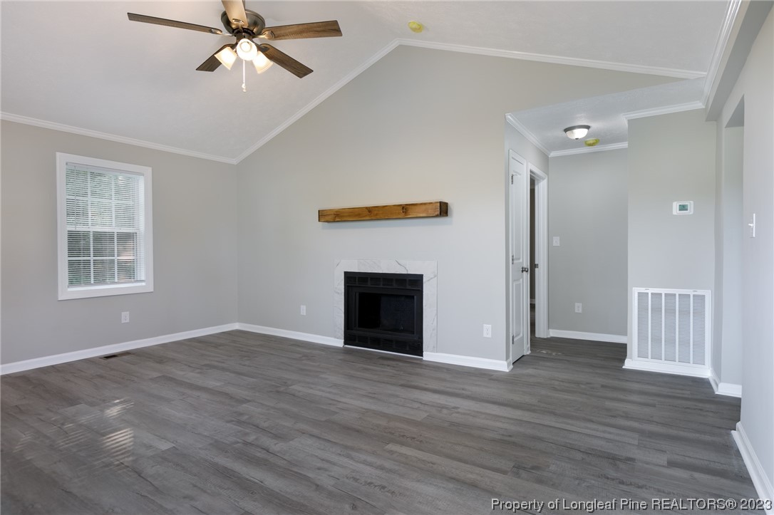 5348 Goldsboro Road Wade, NC 28395 - Photo 5 of 25 a view of an empty room with wooden floor and a window