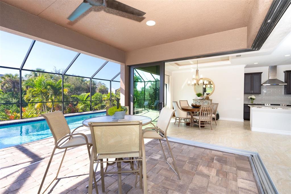85 Spaniards Road Placida, FL 33946 - Photo 19 of 53 a living room with patio furniture and a floor to ceiling windows