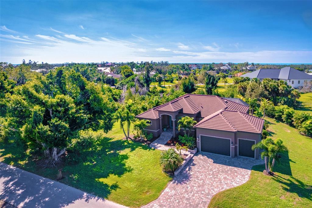 85 Spaniards Road Placida, FL 33946 - Photo 2 of 53 a view of yard with outdoor seating and green space