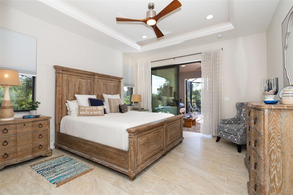 85 Spaniards Road Placida, FL 33946 - Photo 29 of 53 a bed room with a bed and a chandelier