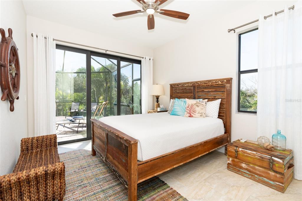 85 Spaniards Road Placida, FL 33946 - Photo 36 of 53 a bed sitting in a bedroom next to a window