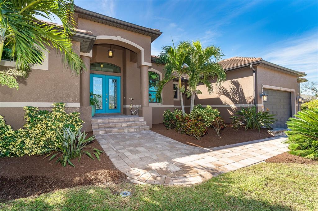 85 Spaniards Road Placida, FL 33946 - Photo 4 of 53 a front view of a house with a yard