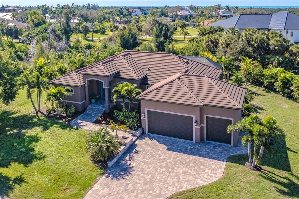 85 Spaniards Road Placida, FL 33946 - Photo 45 of 53 a view of a house with a yard and plants