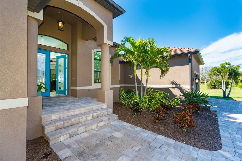 85 Spaniards Road Placida, FL 33946 - Photo 5 of 53 a house with a yard and a potted plant