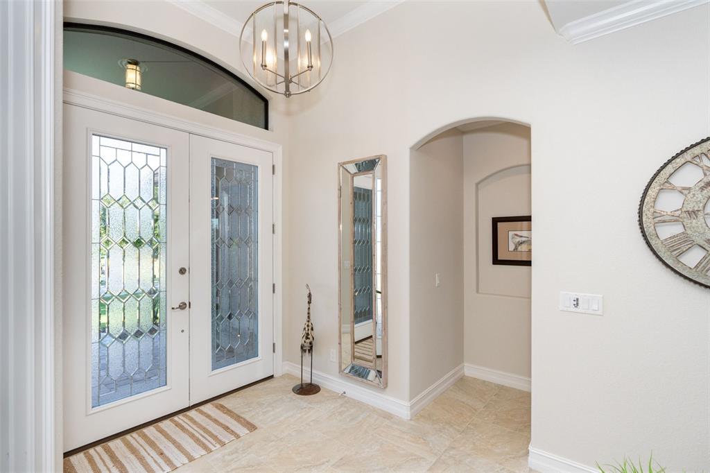 85 Spaniards Road Placida, FL 33946 - Photo 6 of 53 a view of a hallway with windows and chandelier