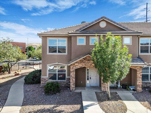 3155 South Hidden Dr Street, Unit 248 St. George, UT 84790 - Photo 23 of 24 Contemporary stucco exterior with stone accents and a covered entry