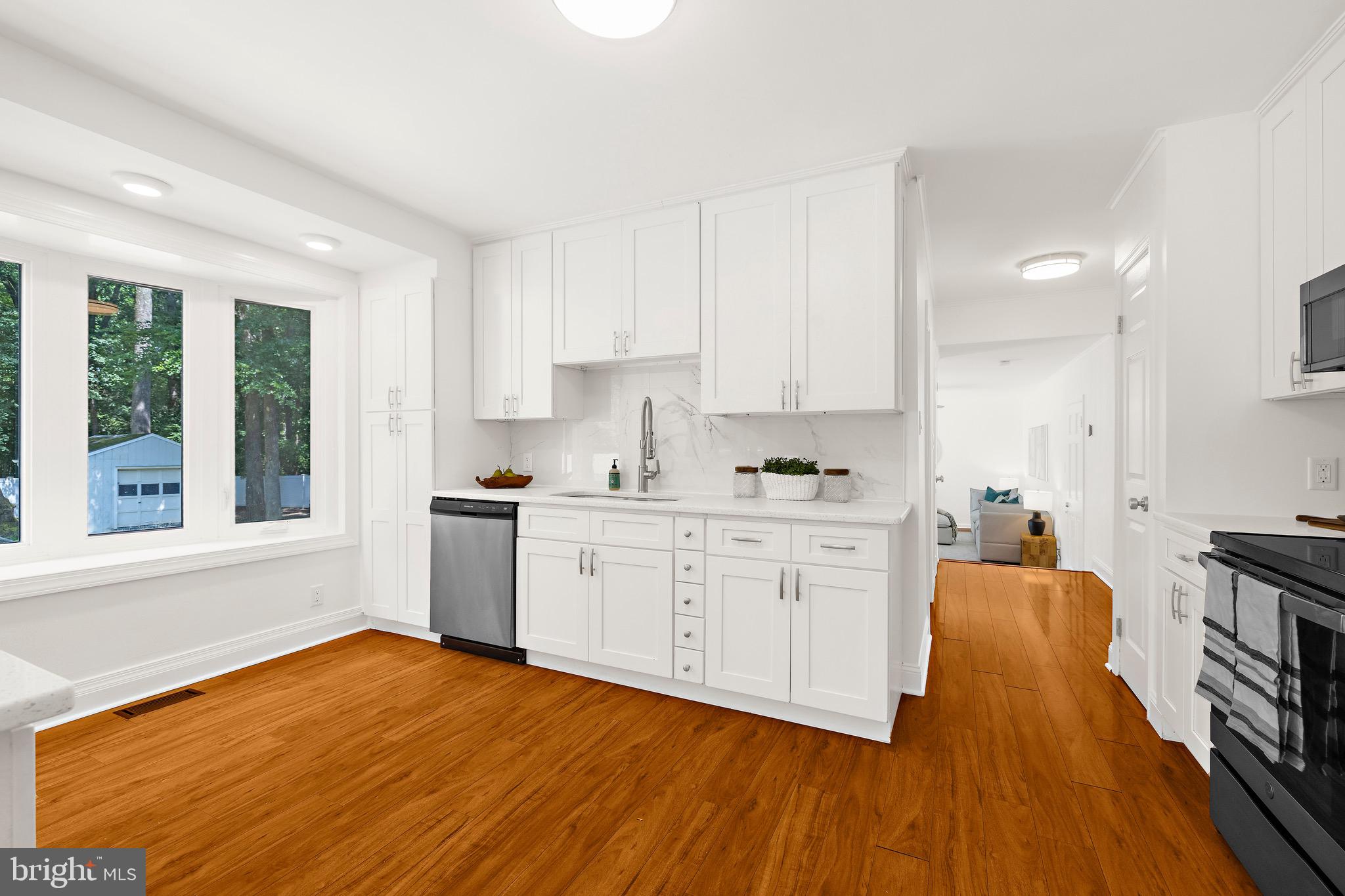 8311 Jacobs Road West Severn, MD 21144 - Photo 4 of 49 Gorgeous white kitchen quartz countertops.