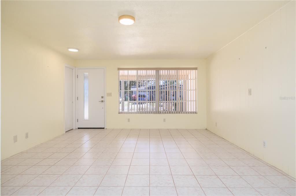 1016 Cherokee Ranch Road Holly Hill, FL 32117 - Photo 3 of 23 an empty room with windows