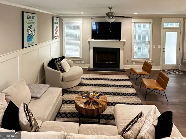 a living room with furniture and a fireplace
