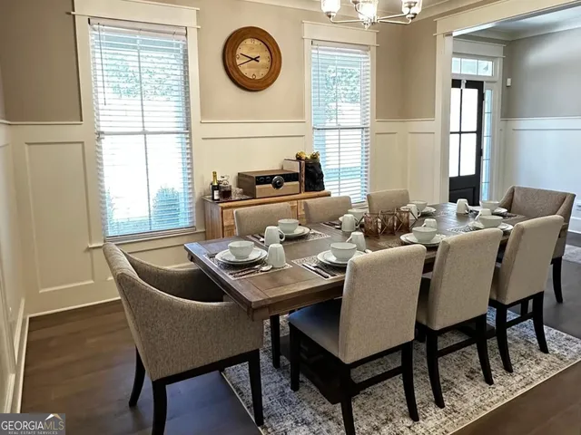 a view of a dining room with furniture and window