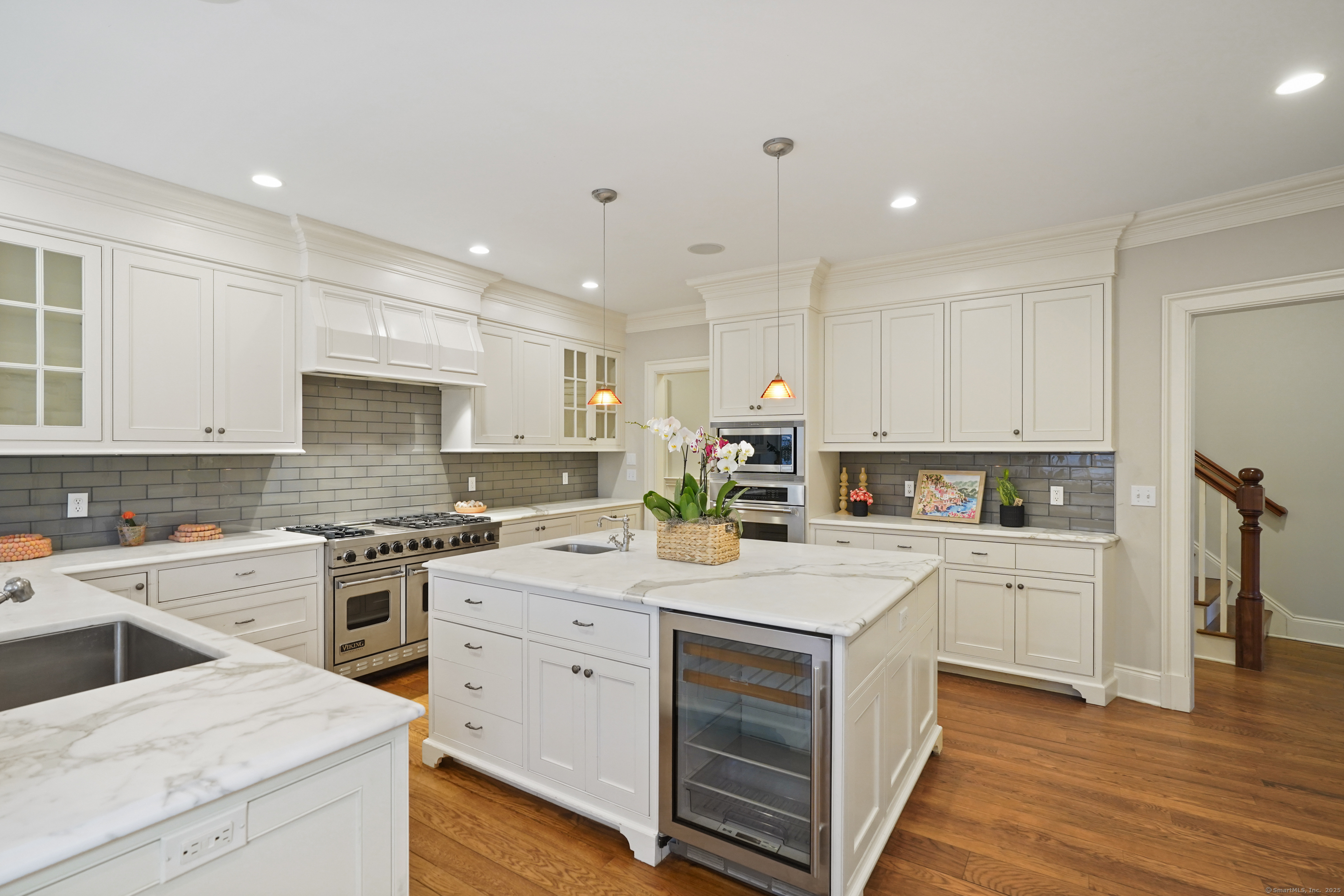 33 Middlebrook Farm Road Wilton, CT 06897 - Photo 12 of 40 a kitchen with a stove top oven sink and cabinets