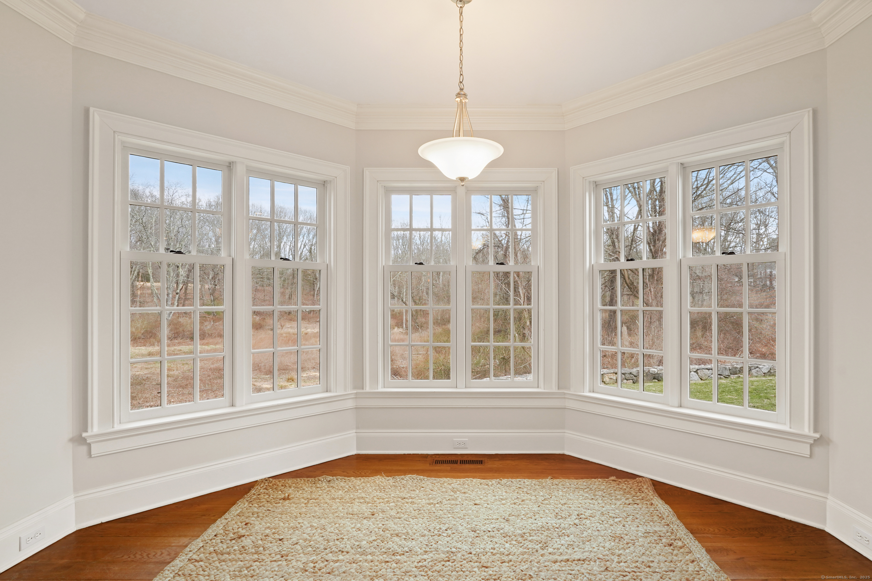 33 Middlebrook Farm Road Wilton, CT 06897 - Photo 19 of 40 a view of an empty room with a window and kitchen view