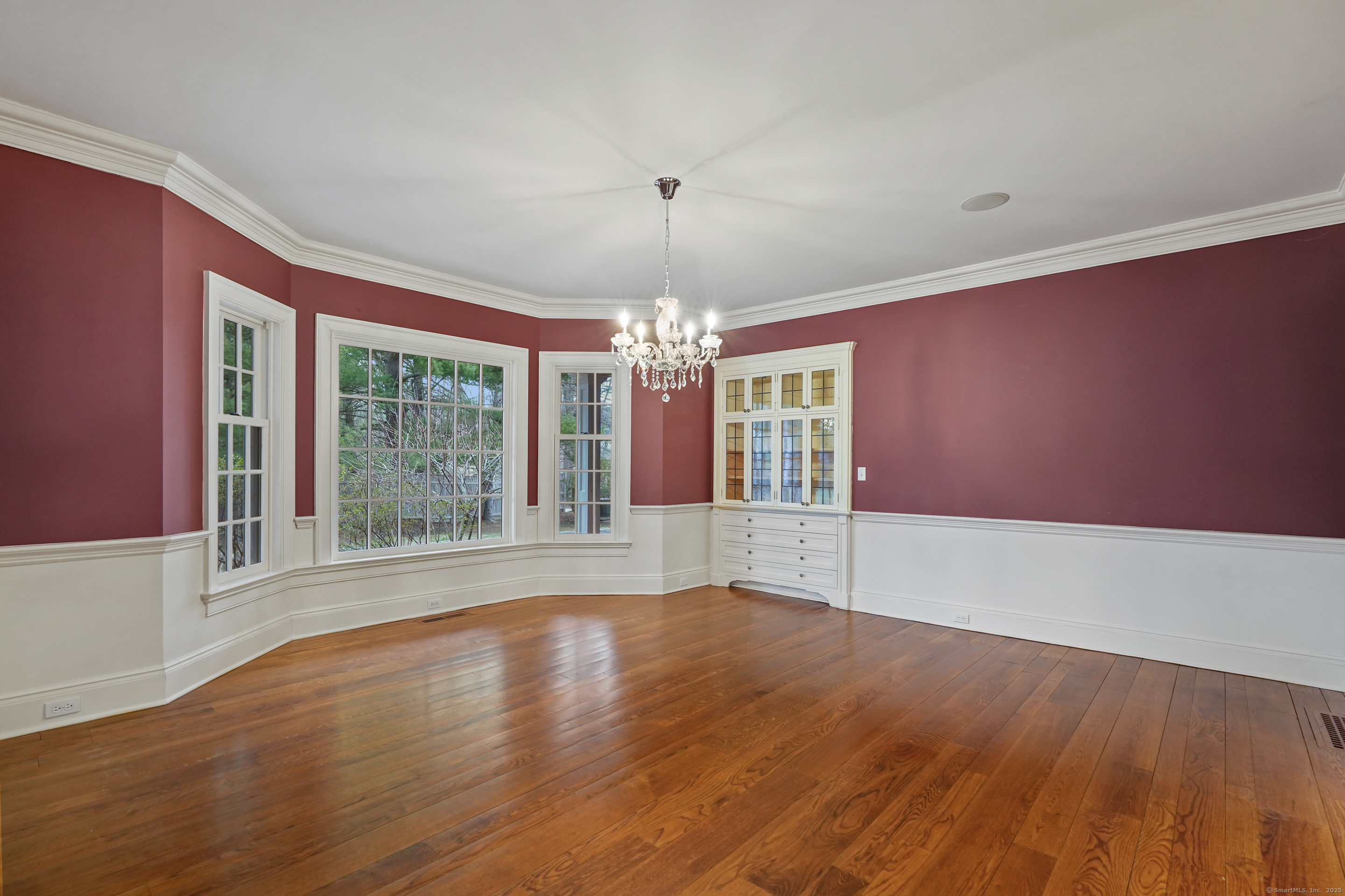 33 Middlebrook Farm Road Wilton, CT 06897 - Photo 21 of 40 a view of an empty room with wooden floor and a window