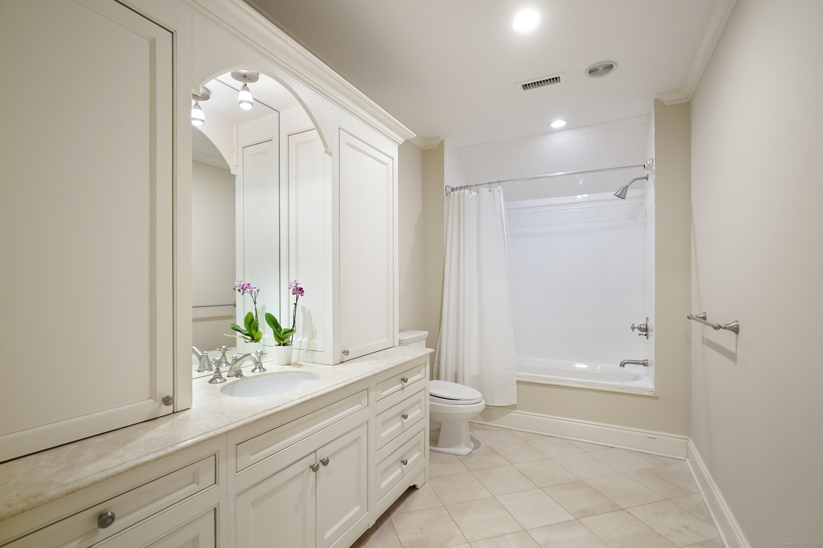 33 Middlebrook Farm Road Wilton, CT 06897 - Photo 24 of 40 a bathroom with a granite countertop sink a toilet and a mirror