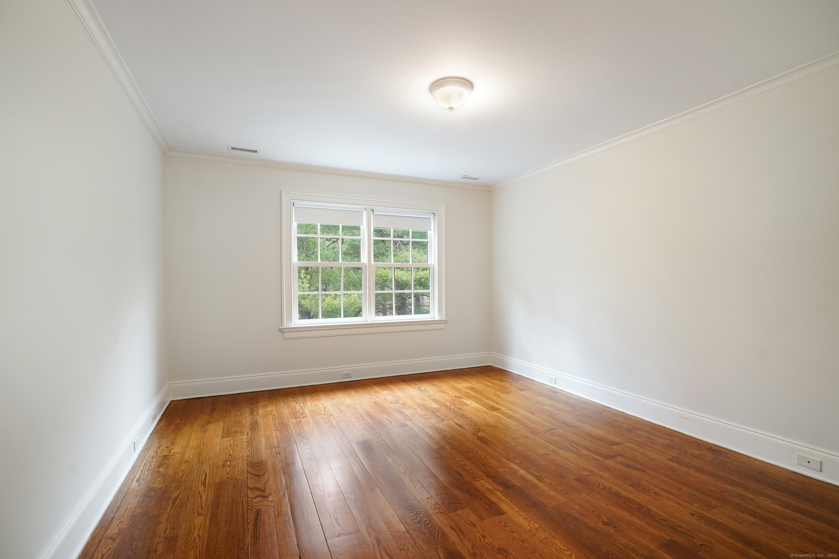 33 Middlebrook Farm Road Wilton, CT 06897 - Photo 26 of 40 an empty room with wooden floor and windows