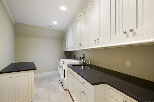 a kitchen with a sink and cabinets