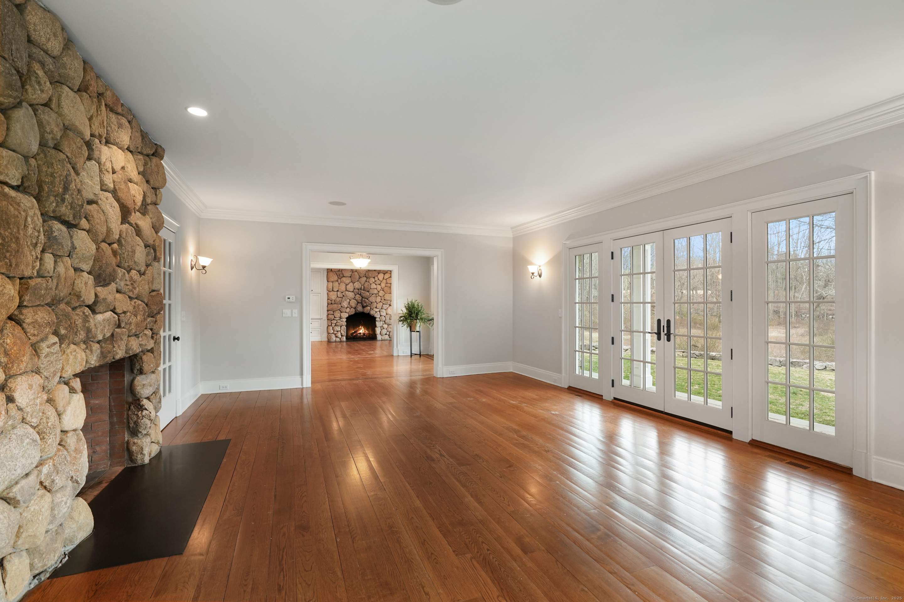 33 Middlebrook Farm Road Wilton, CT 06897 - Photo 3 of 40 wooden floor in an empty room with a window
