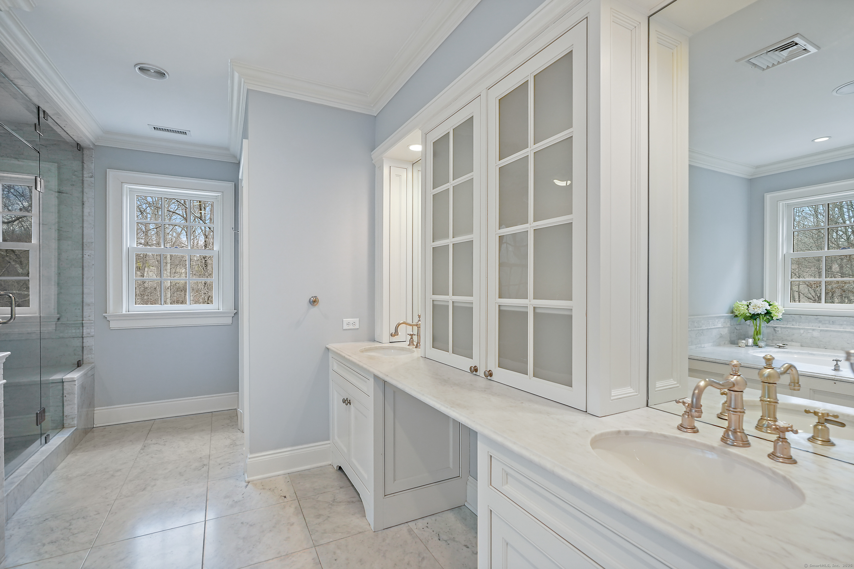 33 Middlebrook Farm Road Wilton, CT 06897 - Photo 34 of 40 a bathroom with a sink and a mirror