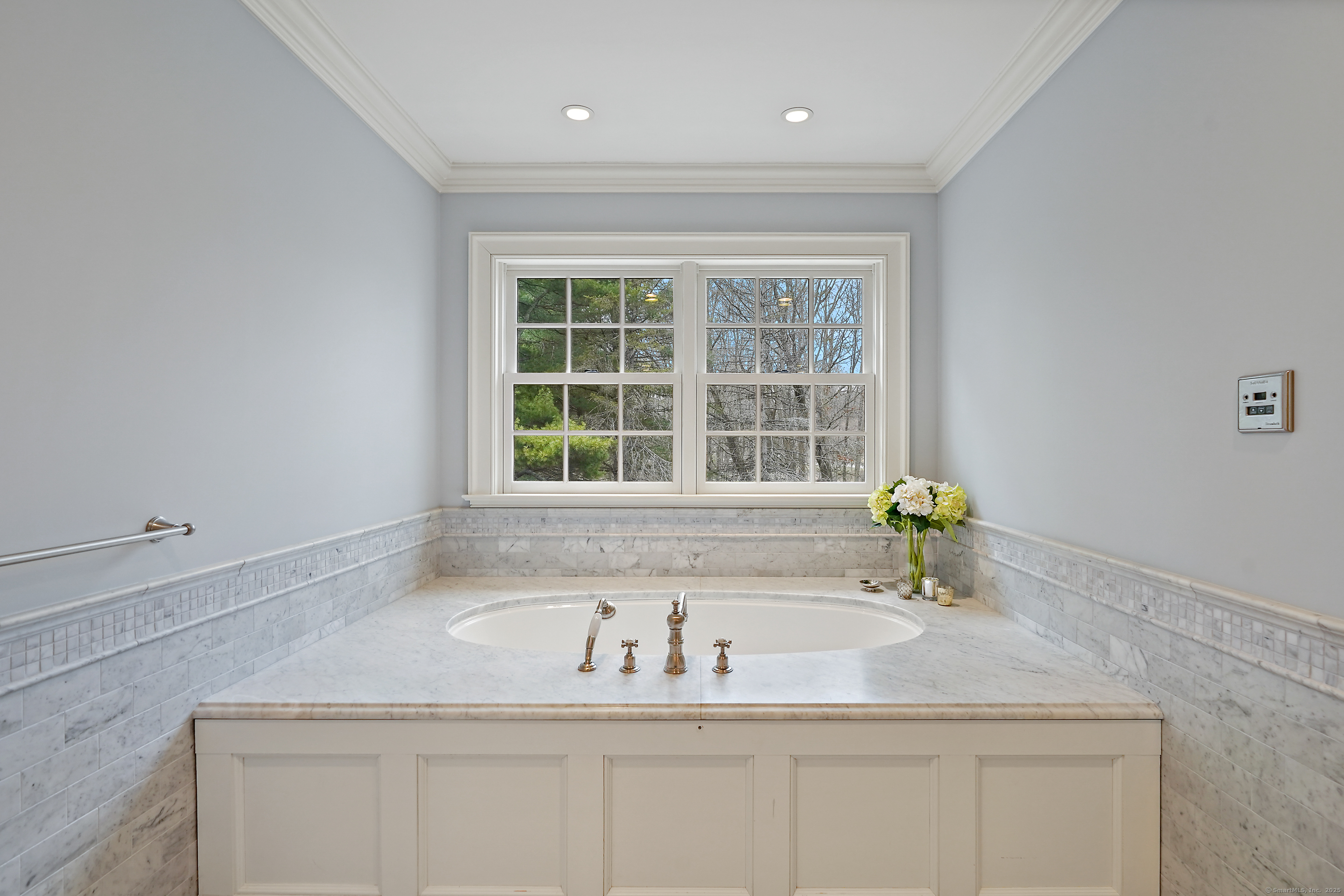33 Middlebrook Farm Road Wilton, CT 06897 - Photo 35 of 40 a bathroom with a granite countertop sink and window