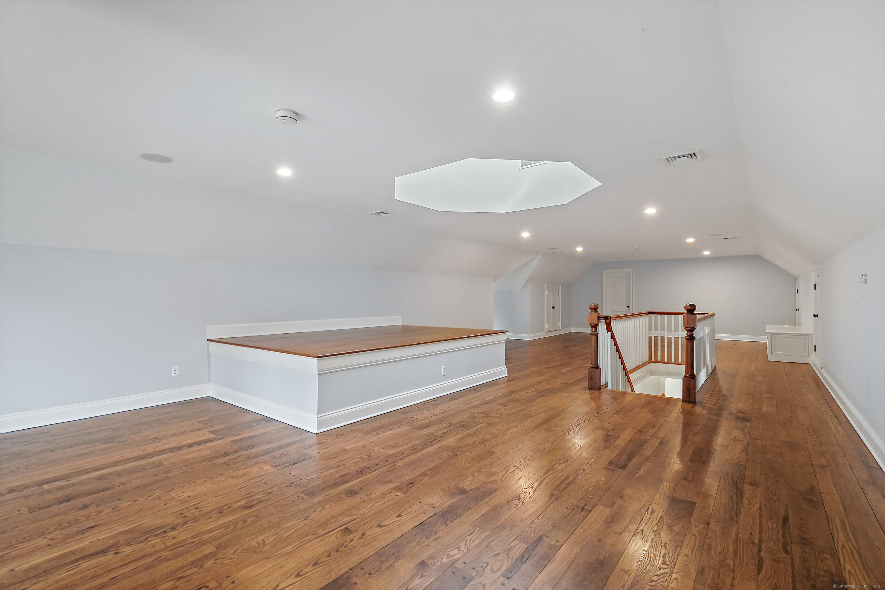 33 Middlebrook Farm Road Wilton, CT 06897 - Photo 37 of 40 a living room with furniture and a wooden floor