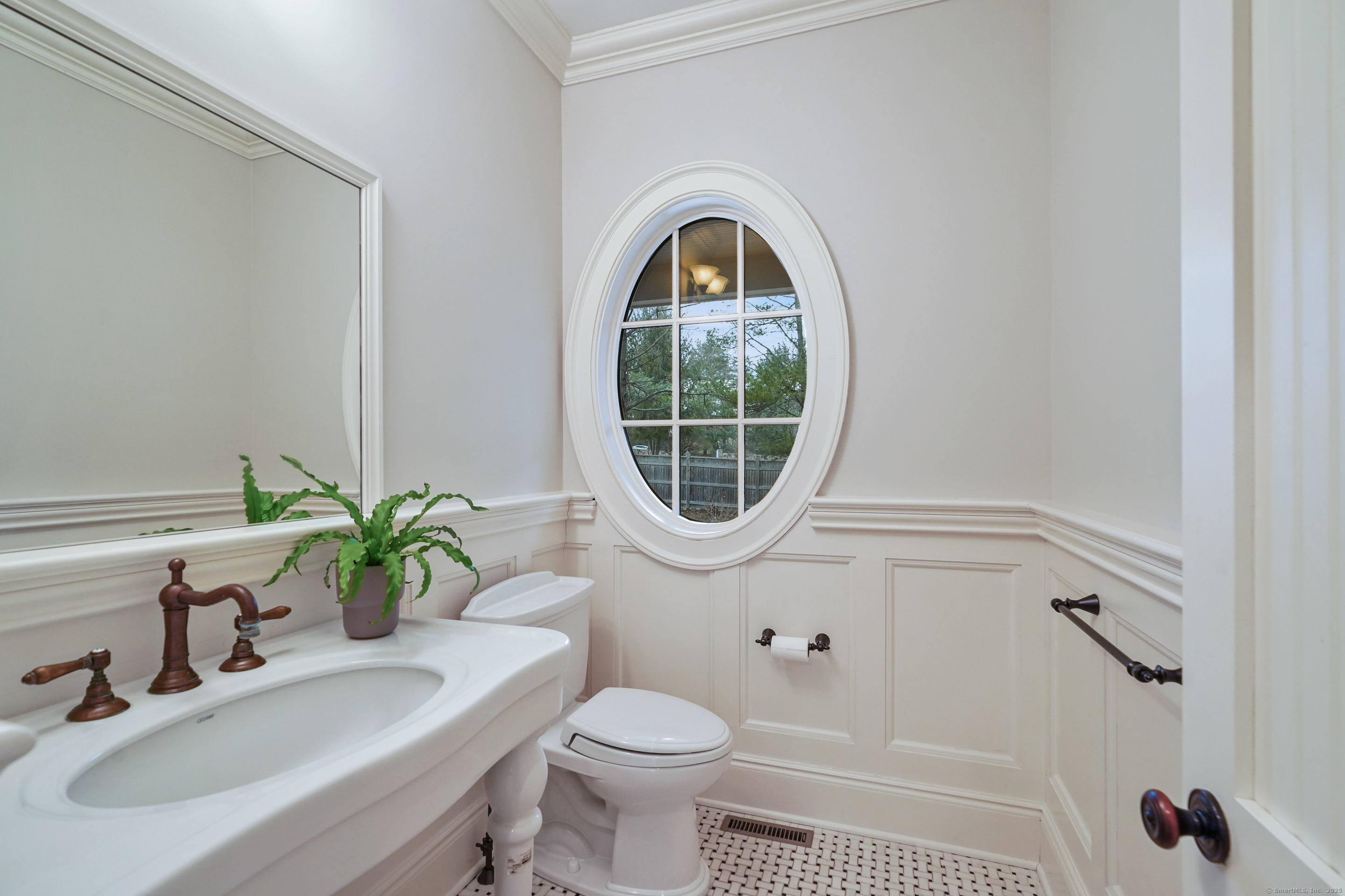 33 Middlebrook Farm Road Wilton, CT 06897 - Photo 10 of 40 a bathroom with a sink toilet and a mirror